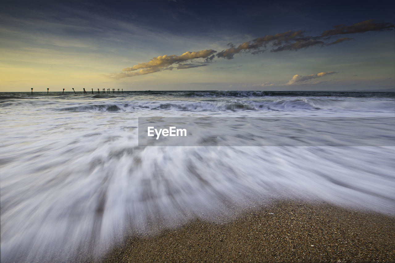 SCENIC VIEW OF SEA DURING SUNSET