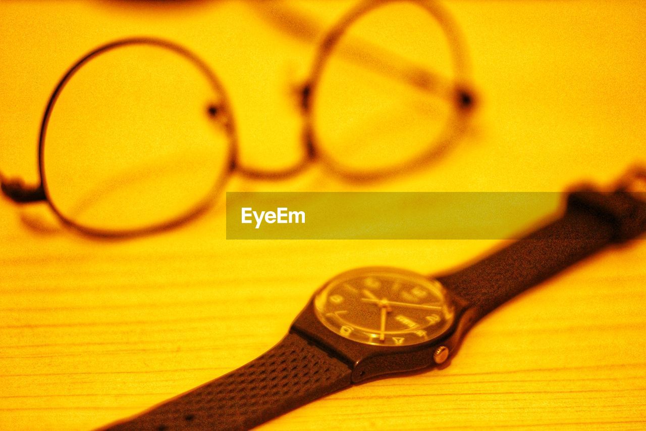 glasses, watch, eyewear, time, vision care, eyeglasses, no people, close-up, yellow, indoors, clock, fashion accessory, business