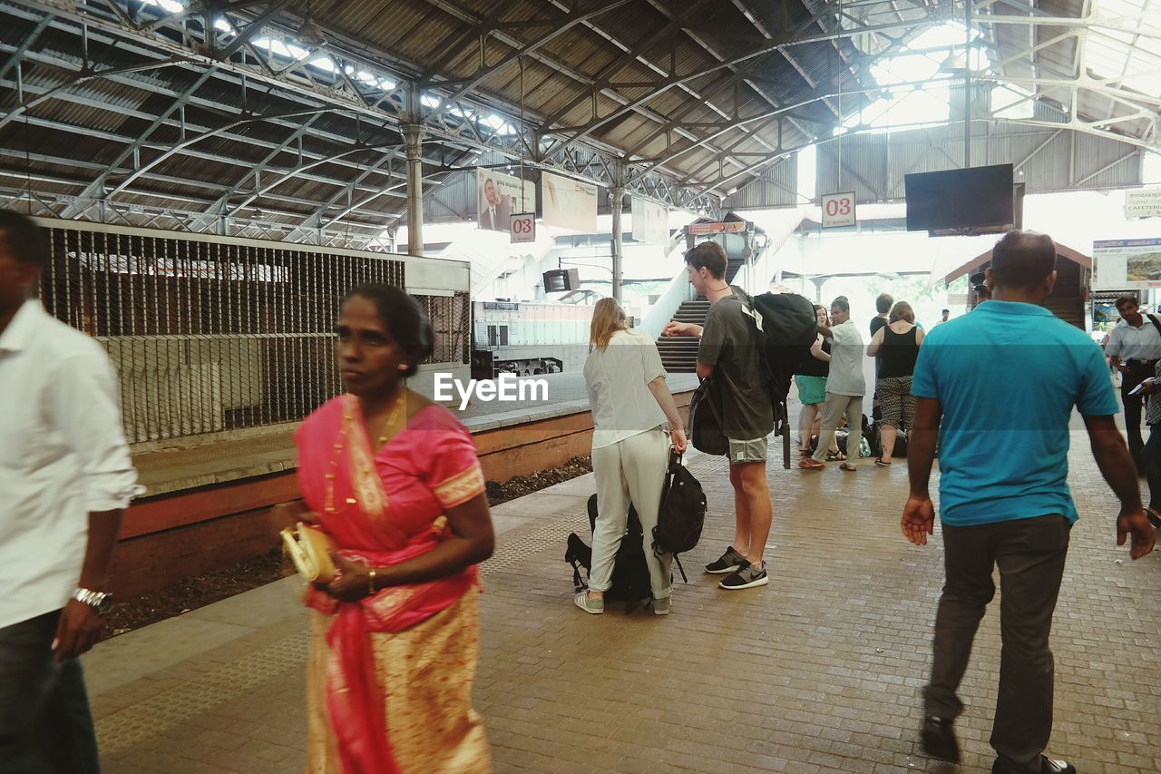 People on railroad station platform