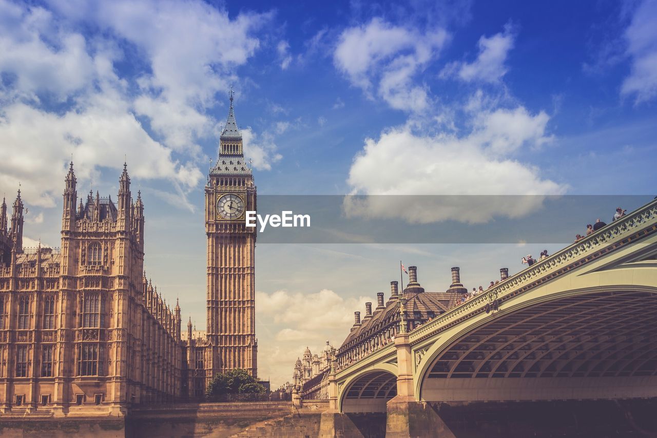 Low angle view of westminster bridge and big ben against sky