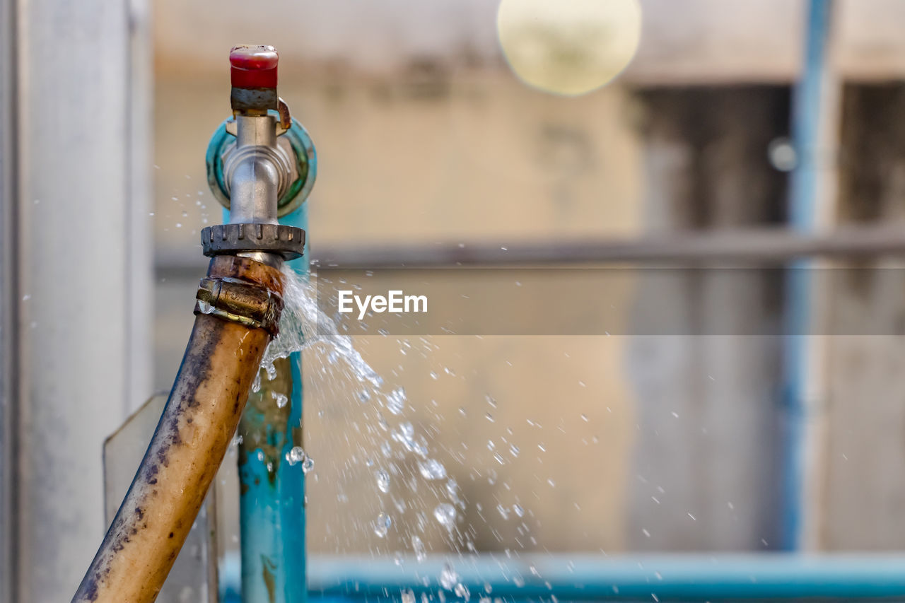 Close-up of water pipe from faucet