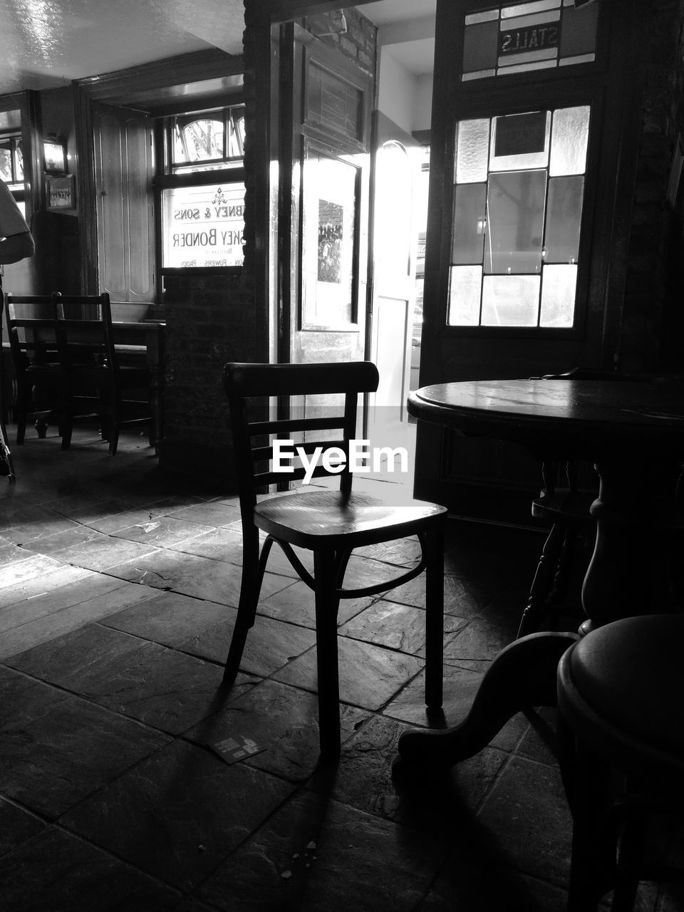 Empty chairs and table at restaurant