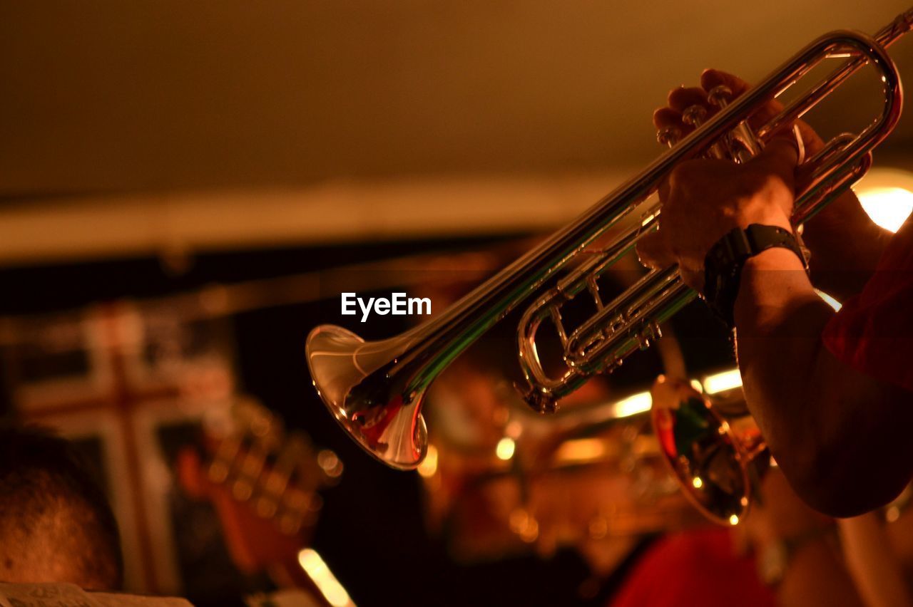 Cropped hands of man playing saxophone