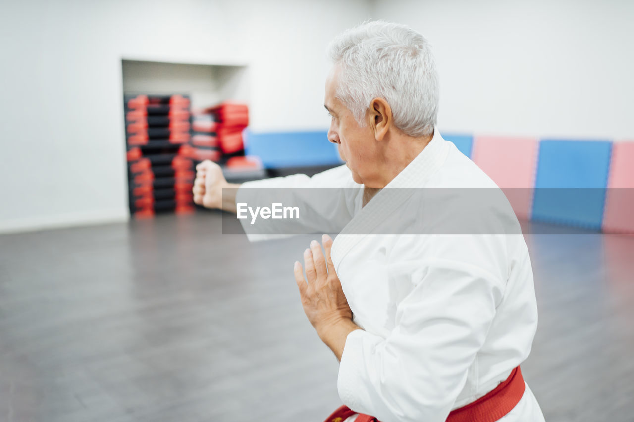 Senior karate master performing combat techniques