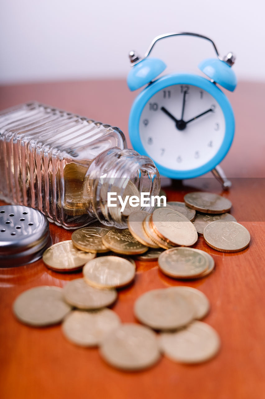 Close-up of clock on table tax concept