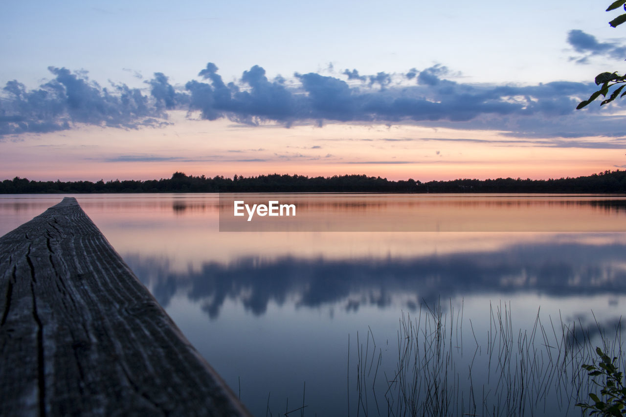 Scenic view of lake against sky during sunset