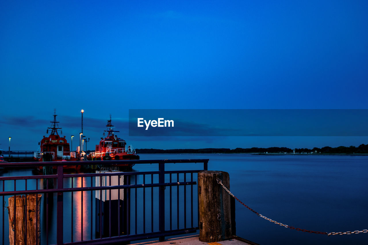 PIER ON SEA AGAINST BLUE SKY