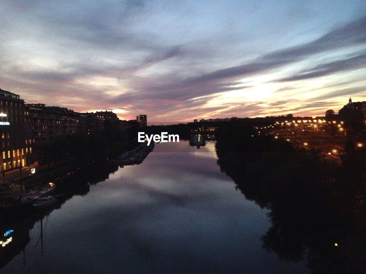 RIVER WITH CITYSCAPE IN BACKGROUND