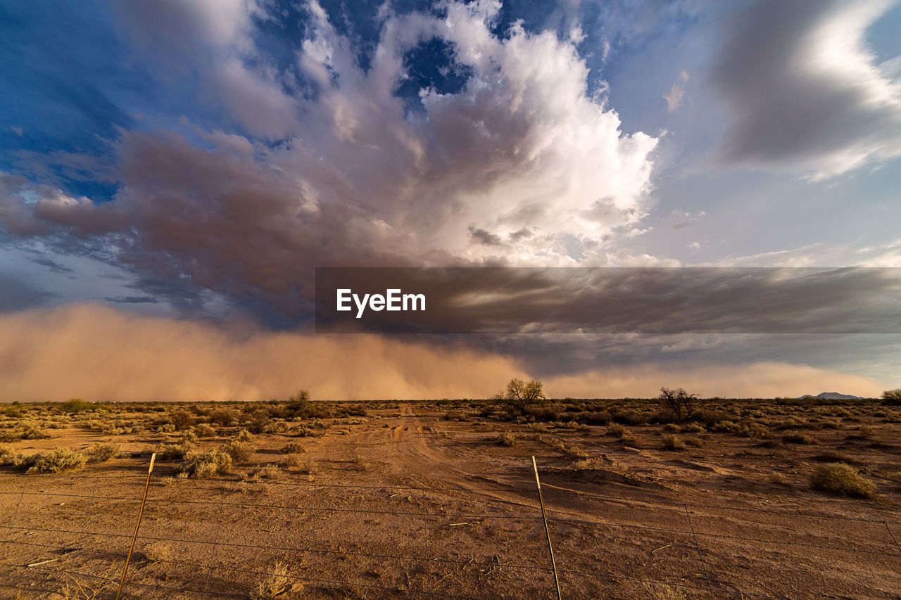 Scenic view of dramatic sky over landscape