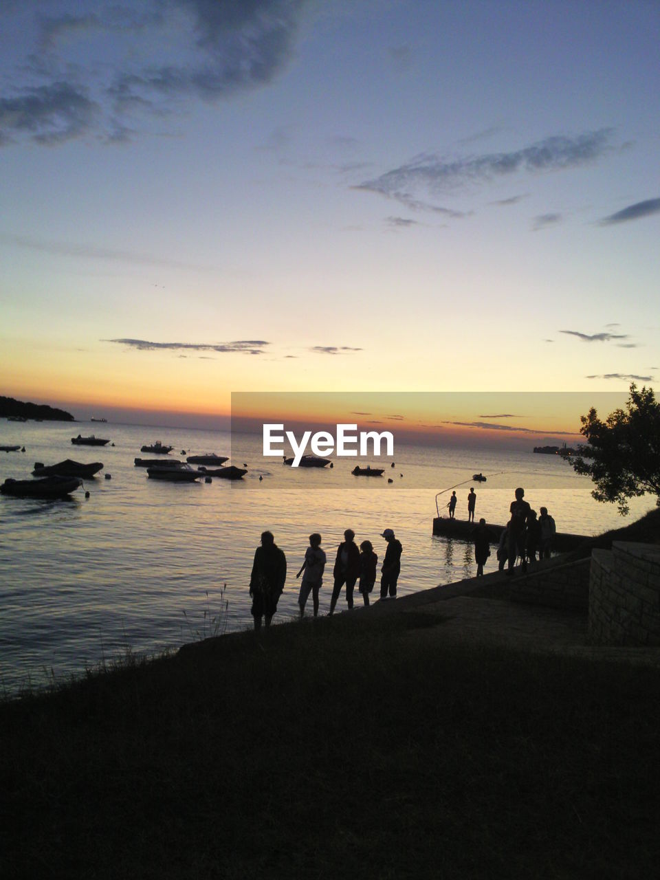 People watching sunset on the beach