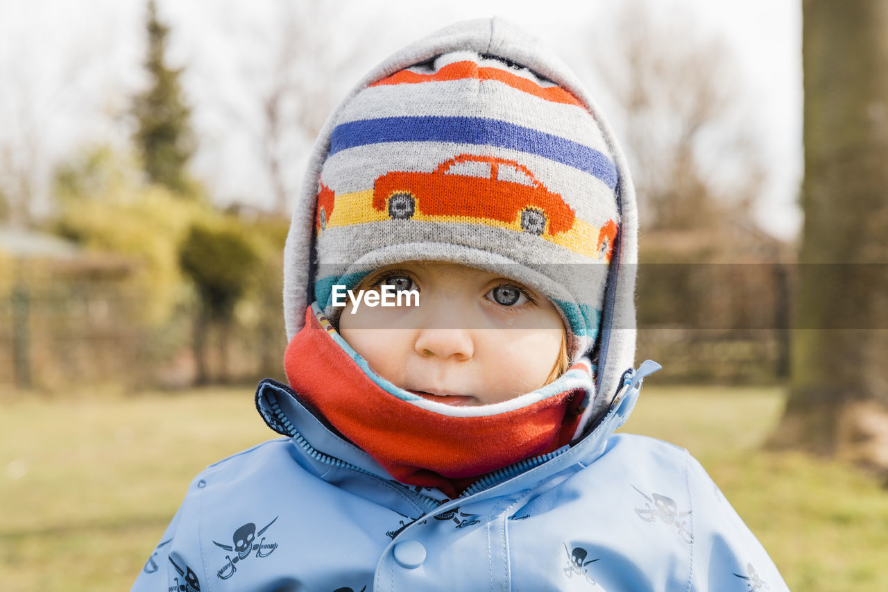 Close-up portrait of toddler girl wearing warm clothing during winter