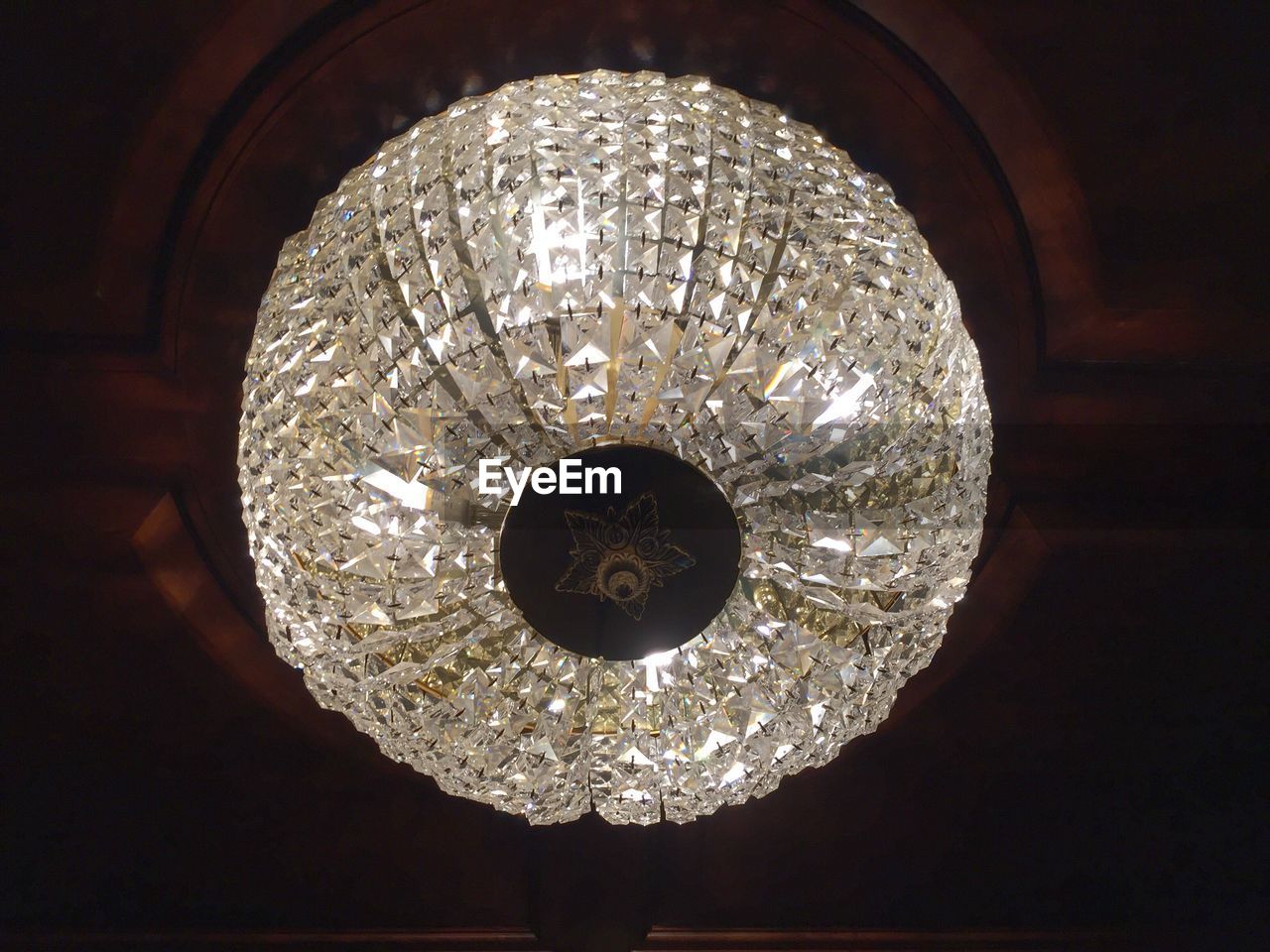 LOW ANGLE VIEW OF ILLUMINATED CHANDELIER
