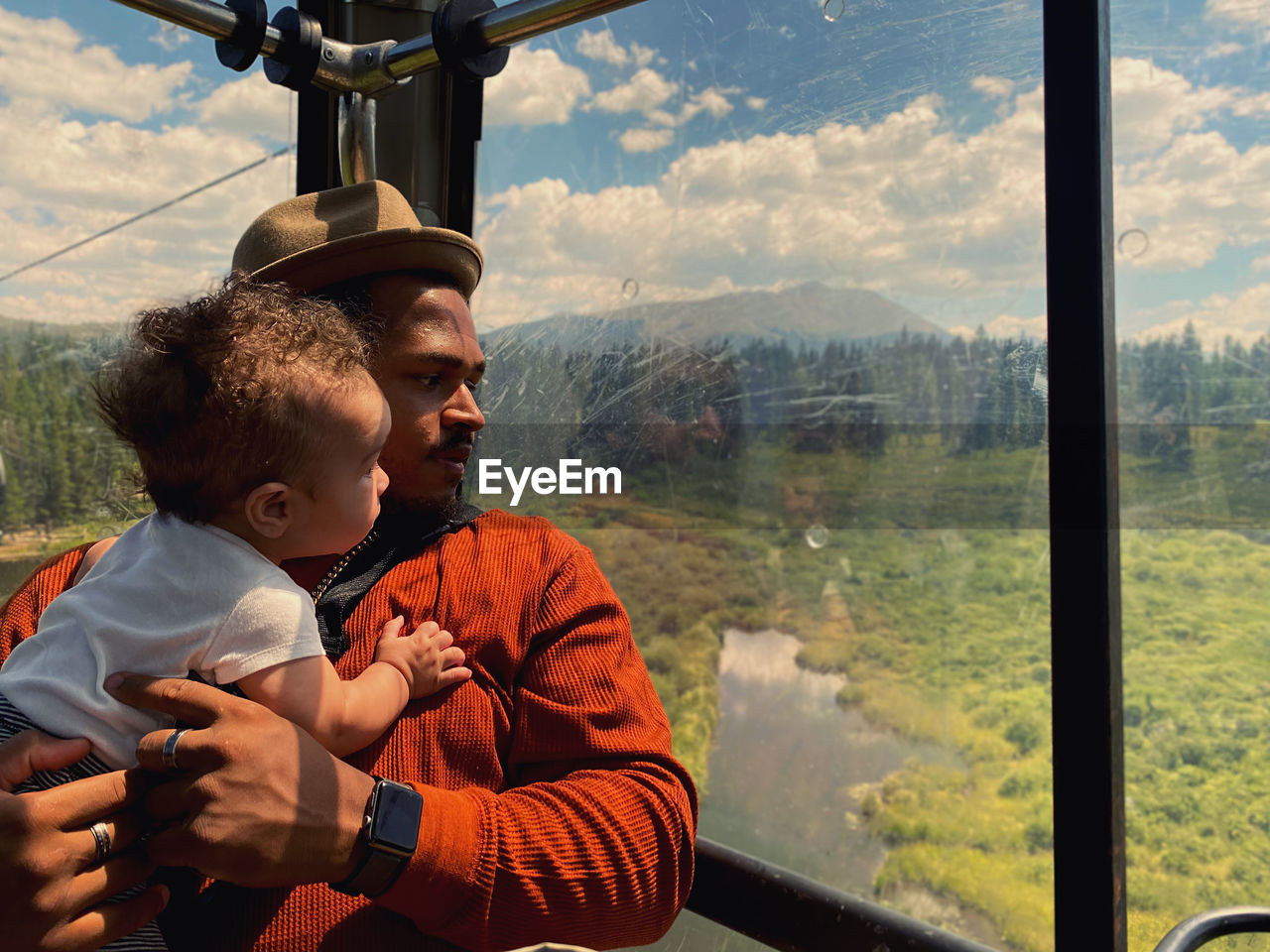 Father and son on window