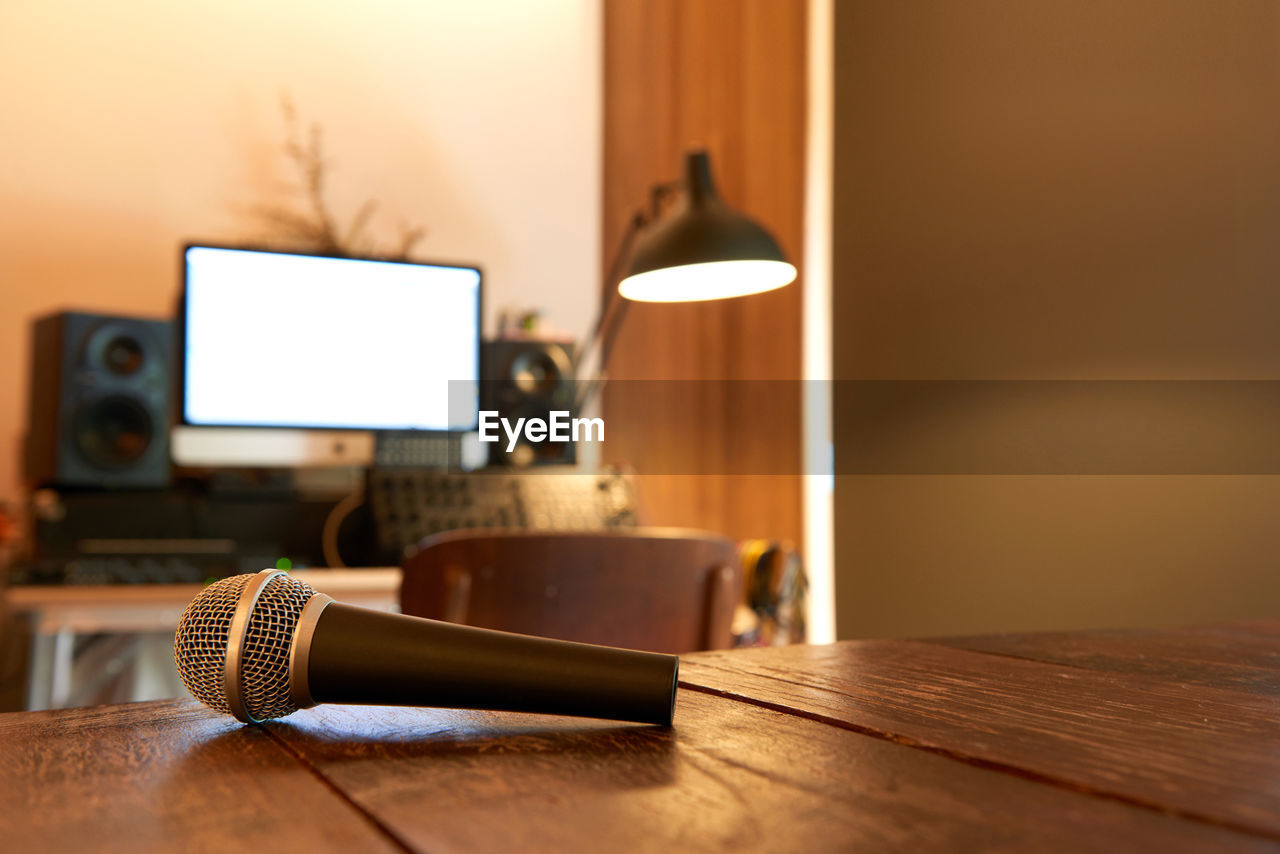 Close-up of microphone on table