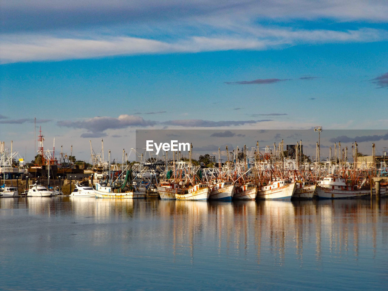 Boats moored at harbor