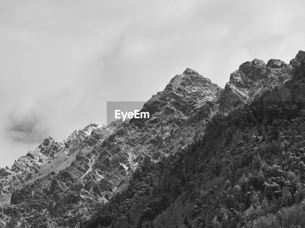 Low angle view of rock formations against sky