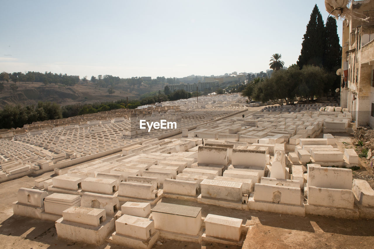 ancient history, architecture, ruins, history, nature, amphitheatre, wall, sky, the past, ancient, temple, archaeological site, travel destinations, built structure, travel, no people, outdoors, day, sand, in a row