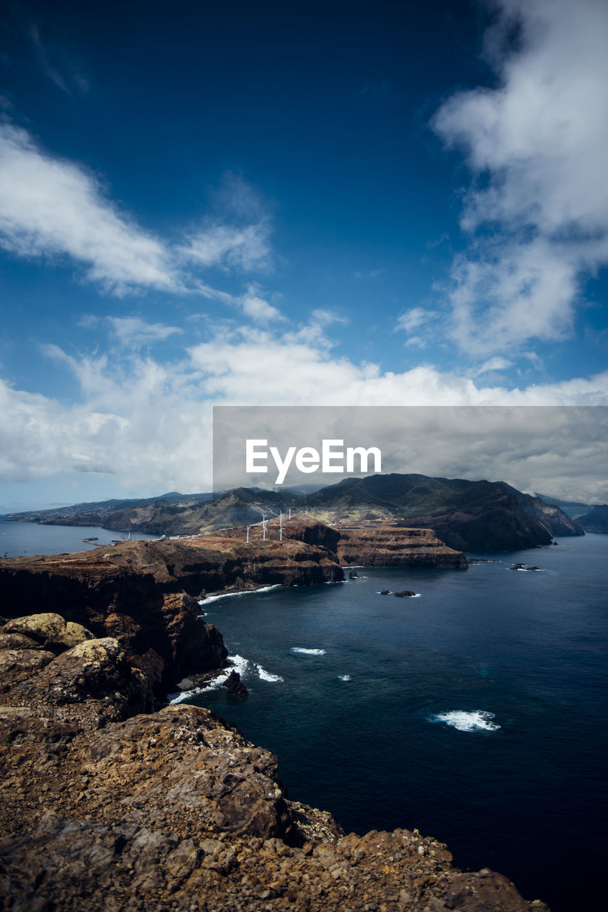 SCENIC VIEW OF SEA AND BAY AGAINST SKY