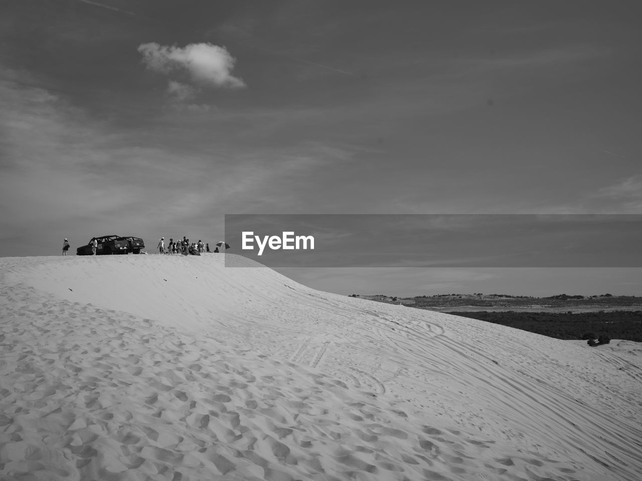 Scenic view of snow covered field against sky