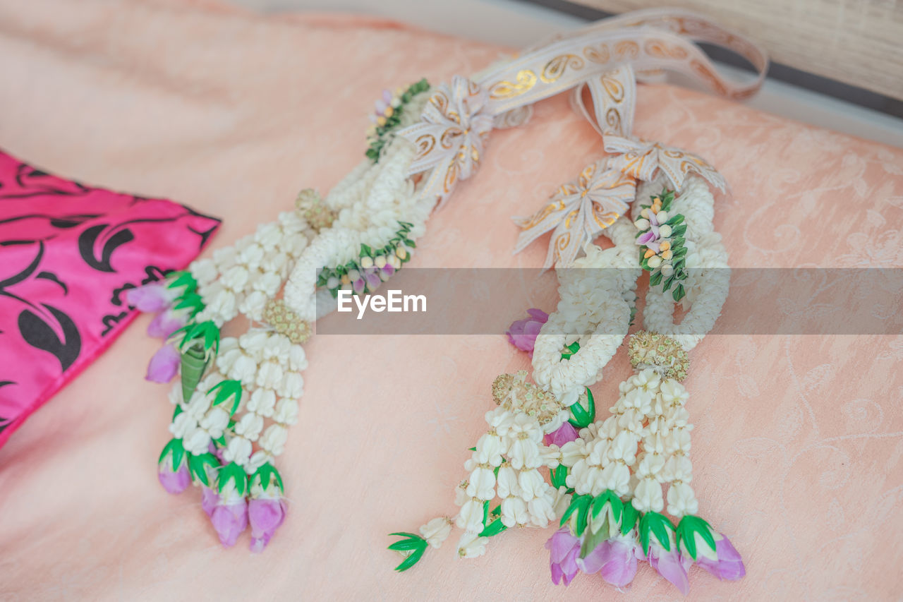 High angle view of floral patterned jewelry at home