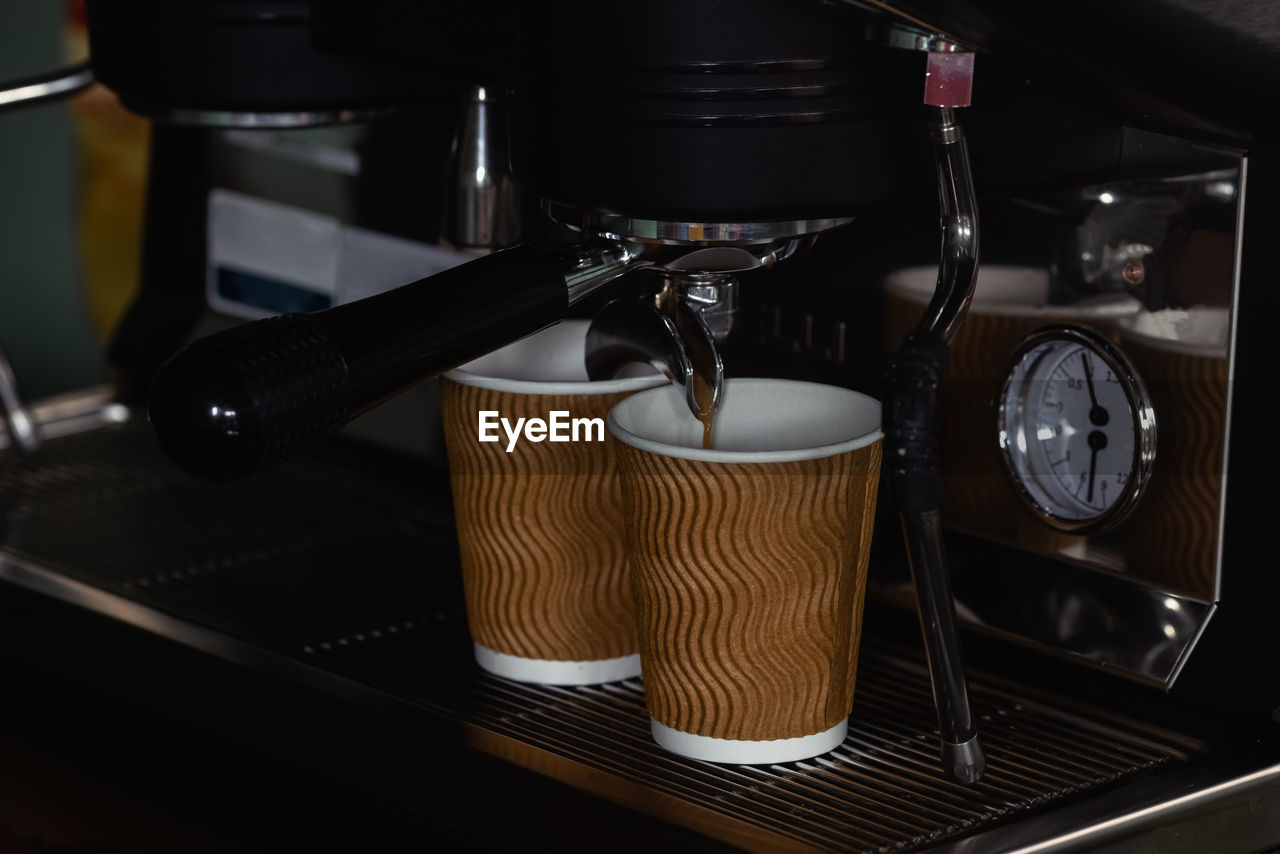 Coffee machine for fresh coffee and infusion into a paper cup, selective focus