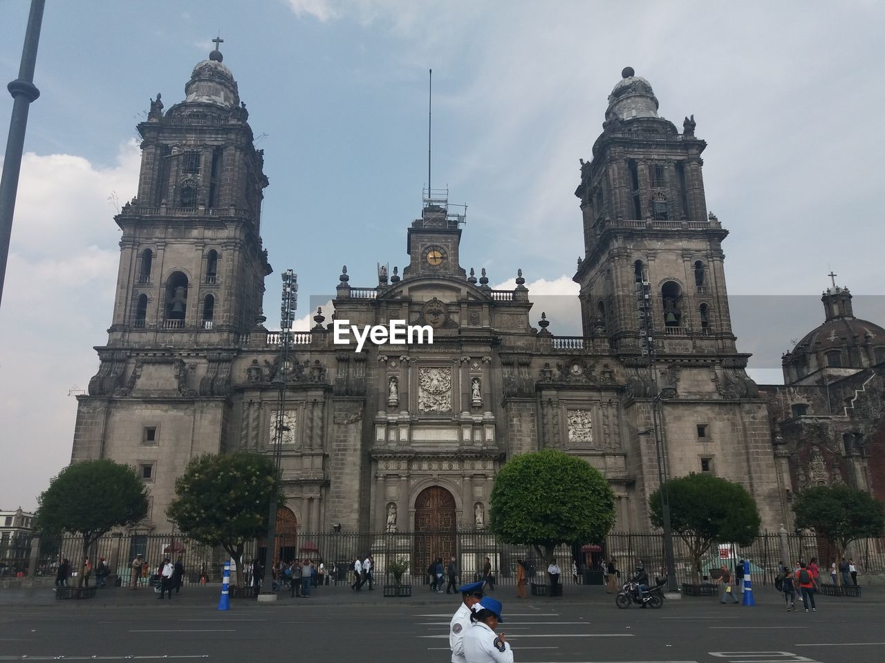 GROUP OF PEOPLE IN FRONT OF CHURCH