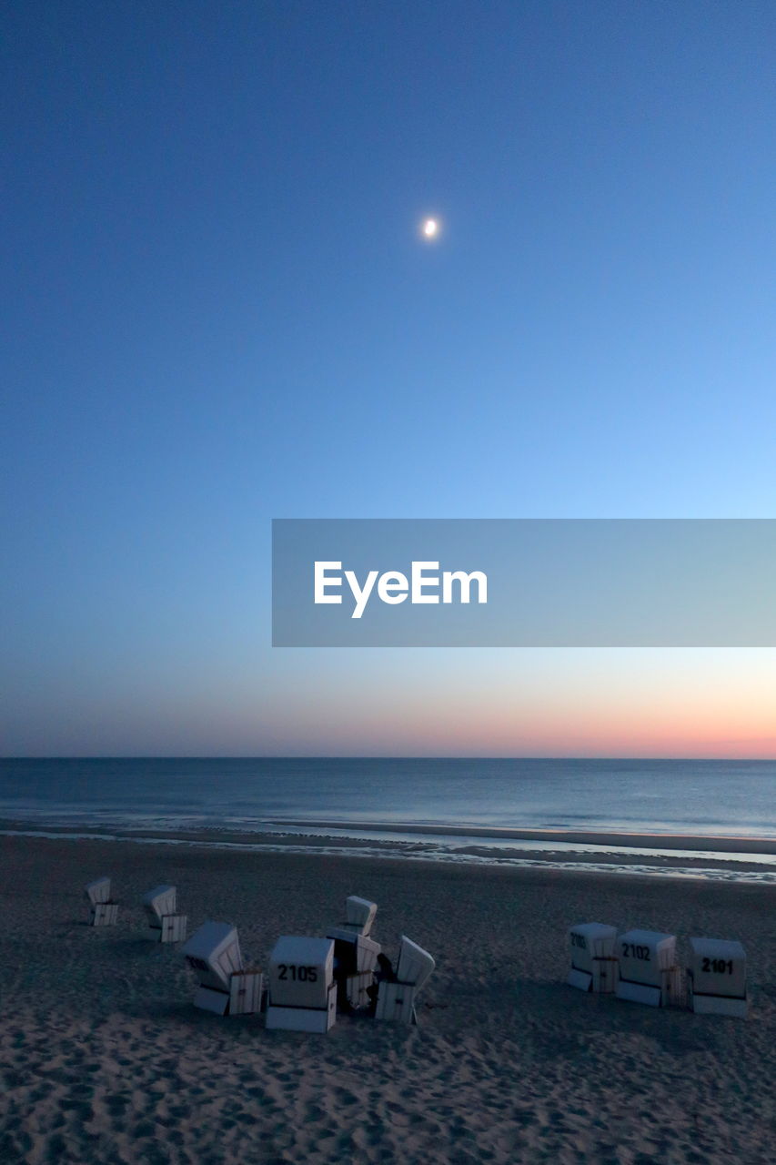 SCENIC VIEW OF BEACH AGAINST CLEAR BLUE SKY