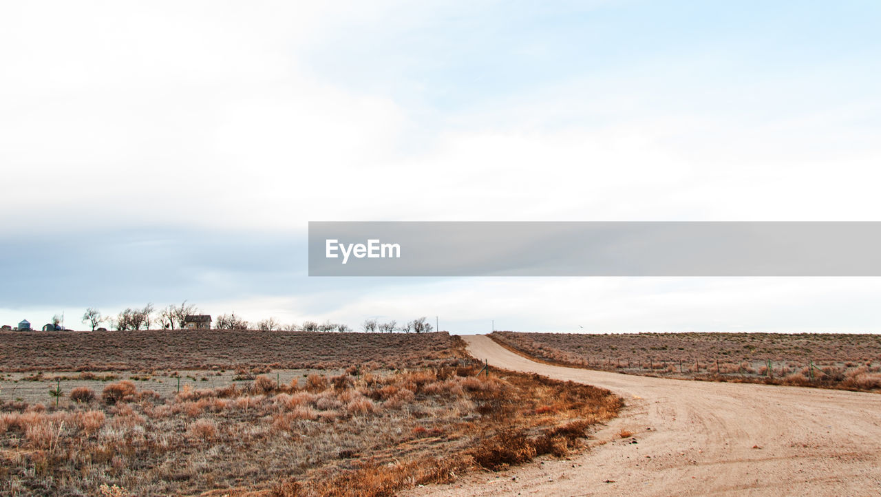 DIRT ROAD PASSING THROUGH FIELD