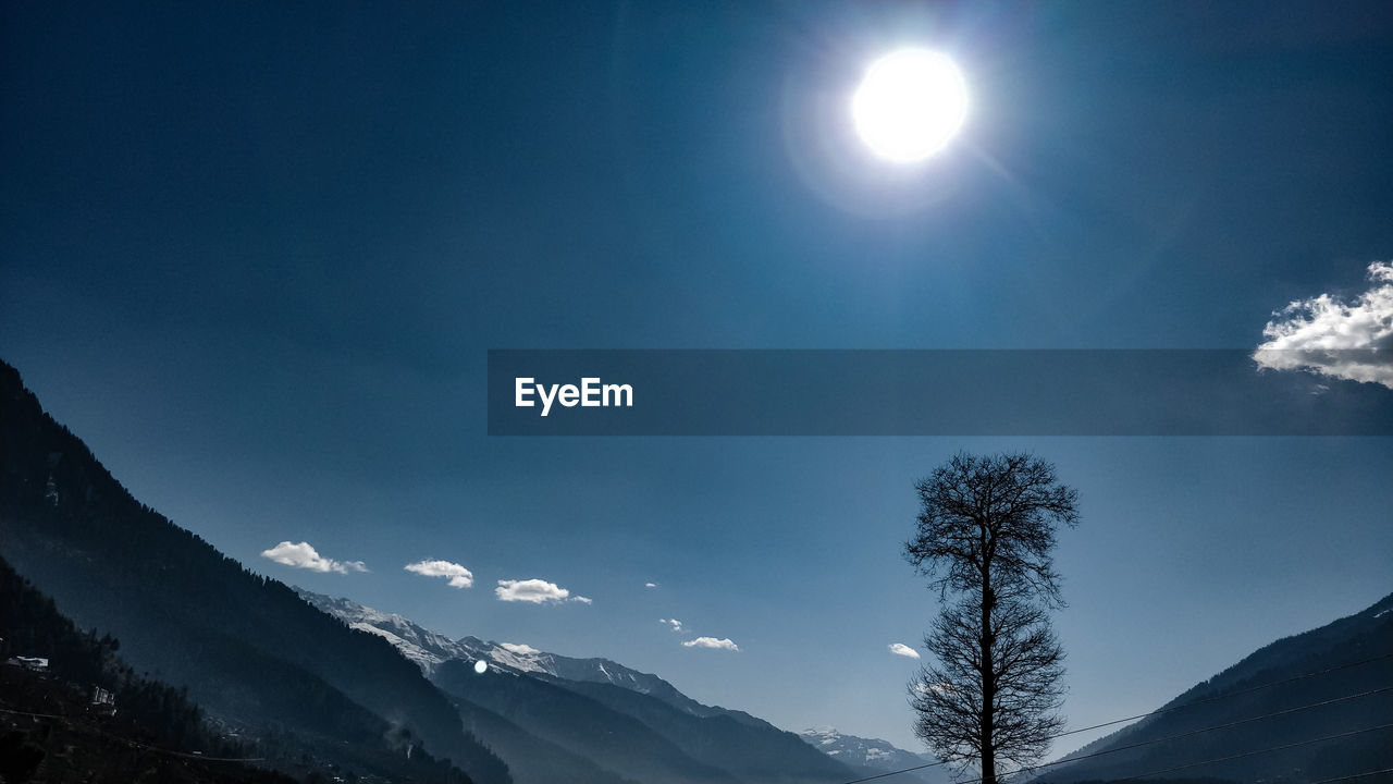 Low angle view of majestic mountains against sky