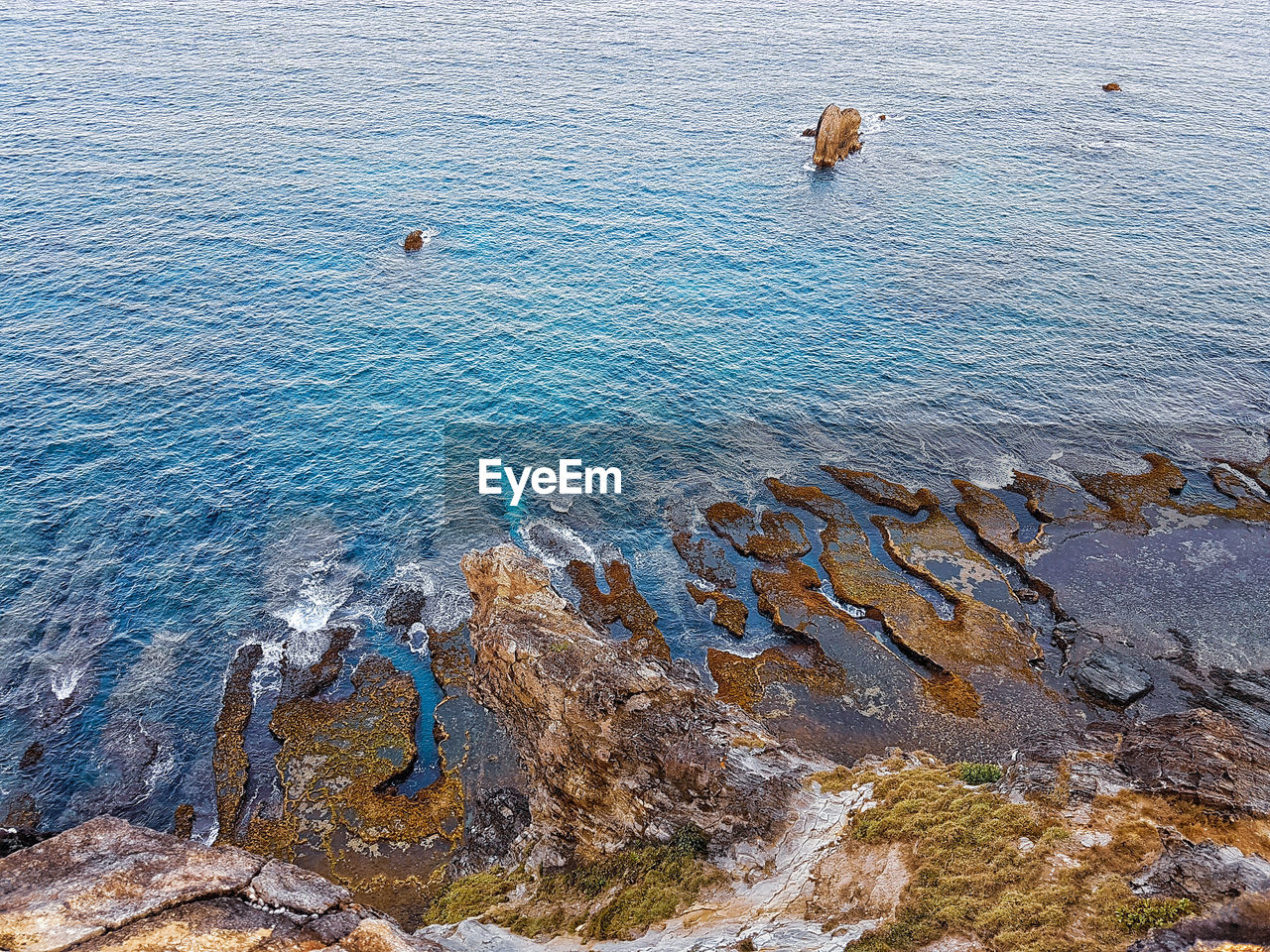 High angle view of rock formation in sea