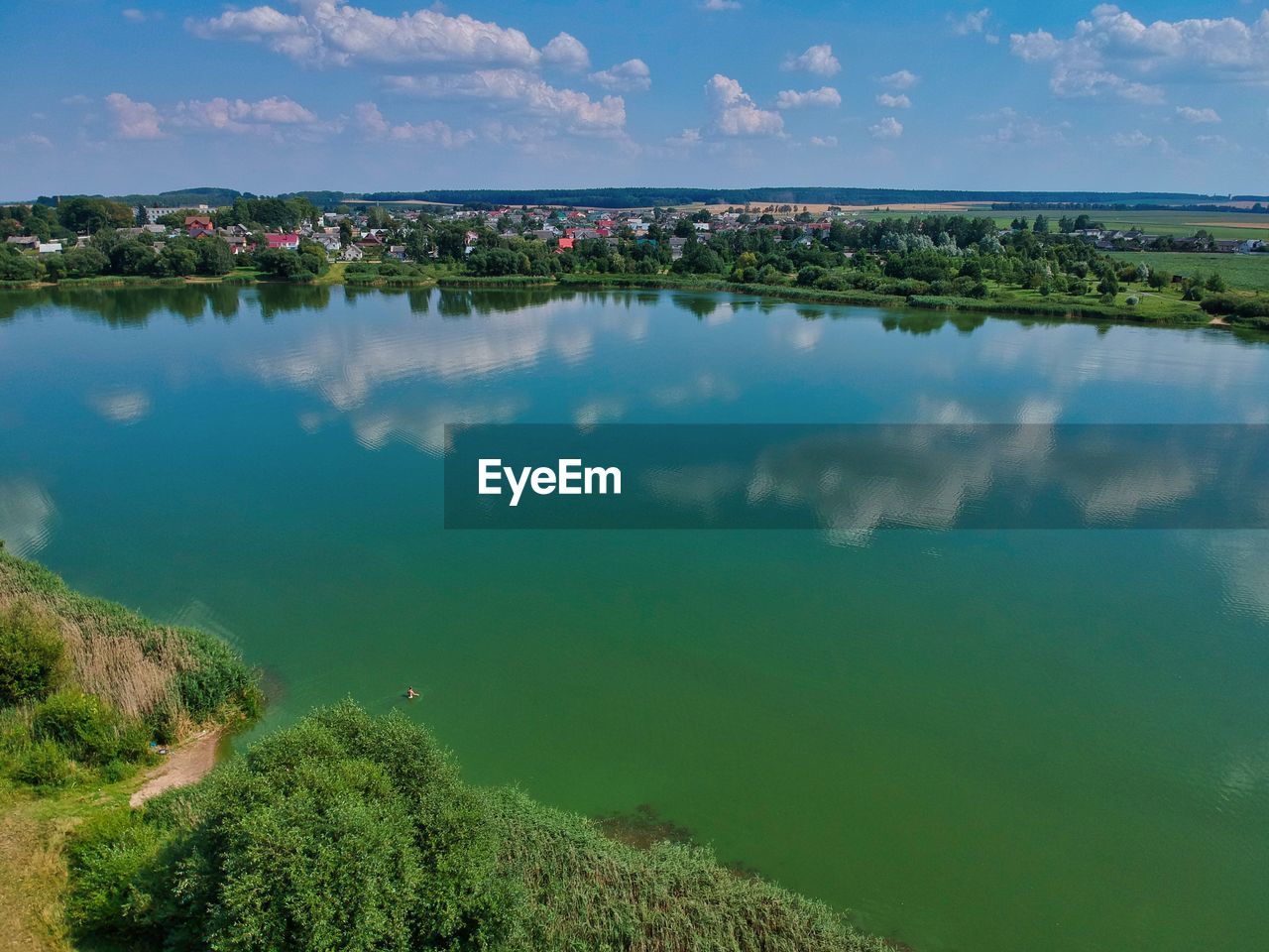 SCENIC VIEW OF LAKE AND TREES AGAINST SKY