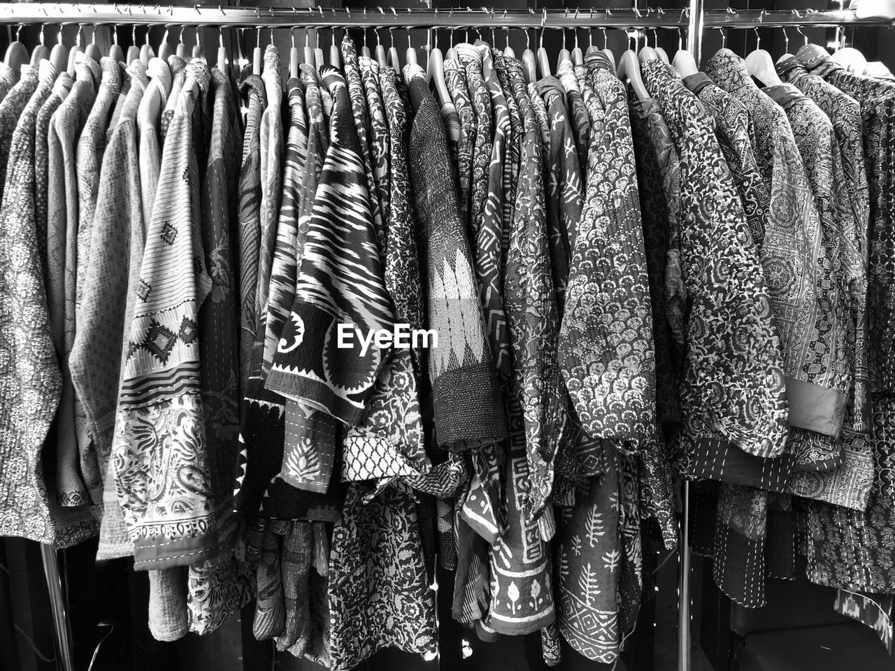 CLOTHES HANGING ON DISPLAY AT STORE