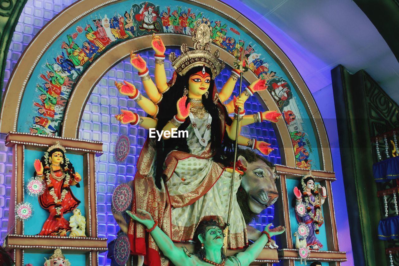 LOW ANGLE VIEW OF STATUES ON TEMPLE