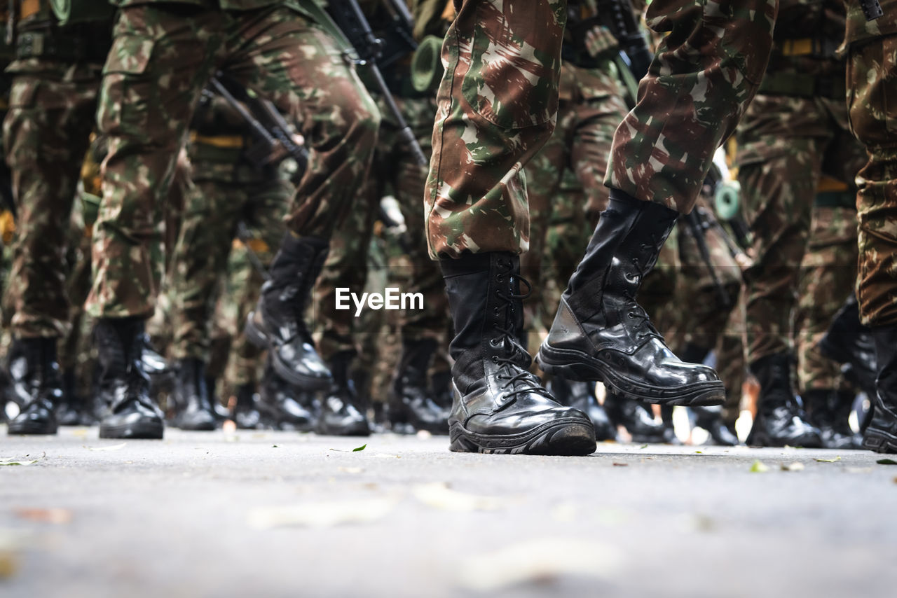 Low section of soldiers standing on street