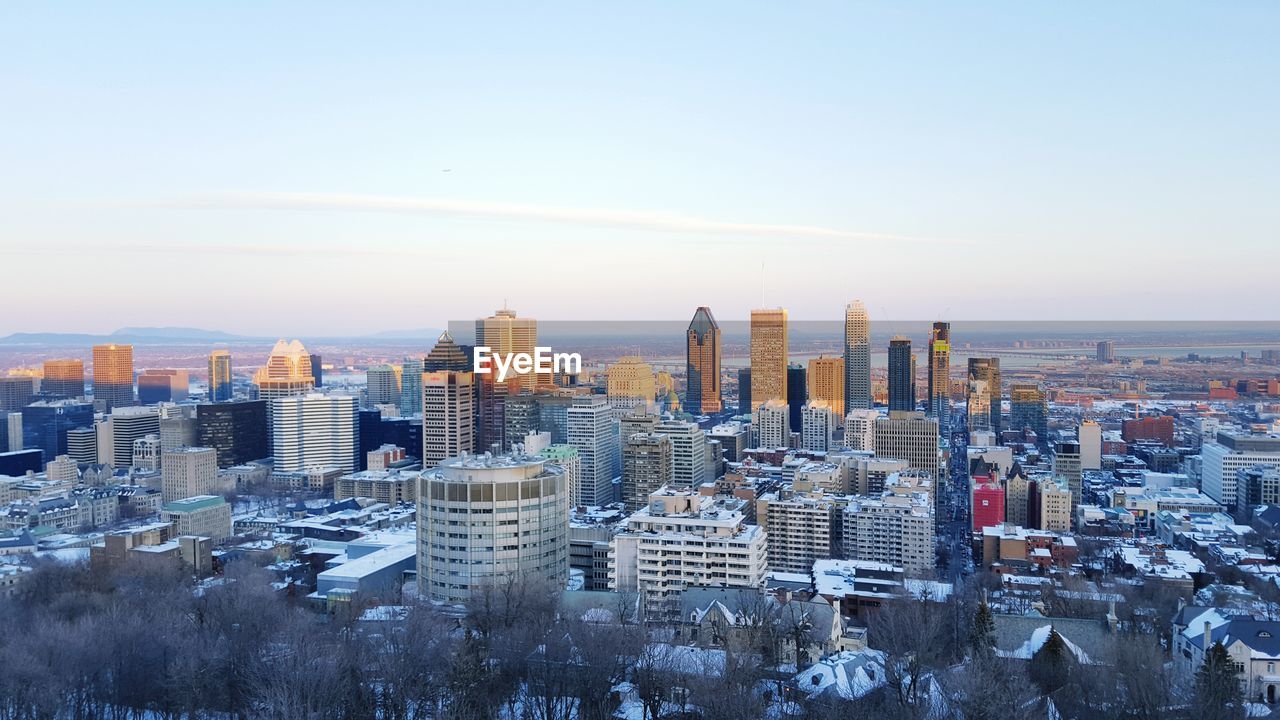 Cityscape against sky during winter