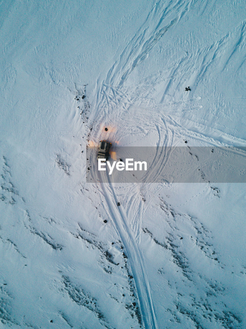 High angle view of car on snow covered landscape