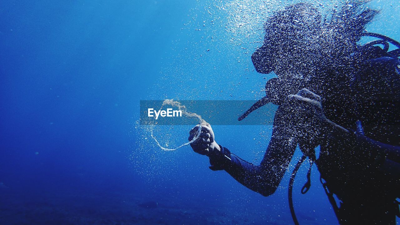 Scuba diver swimming underwater