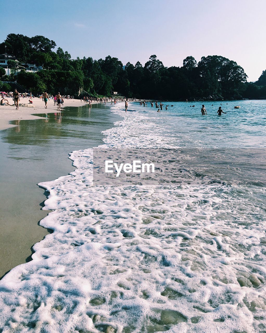 PEOPLE SWIMMING IN SEA