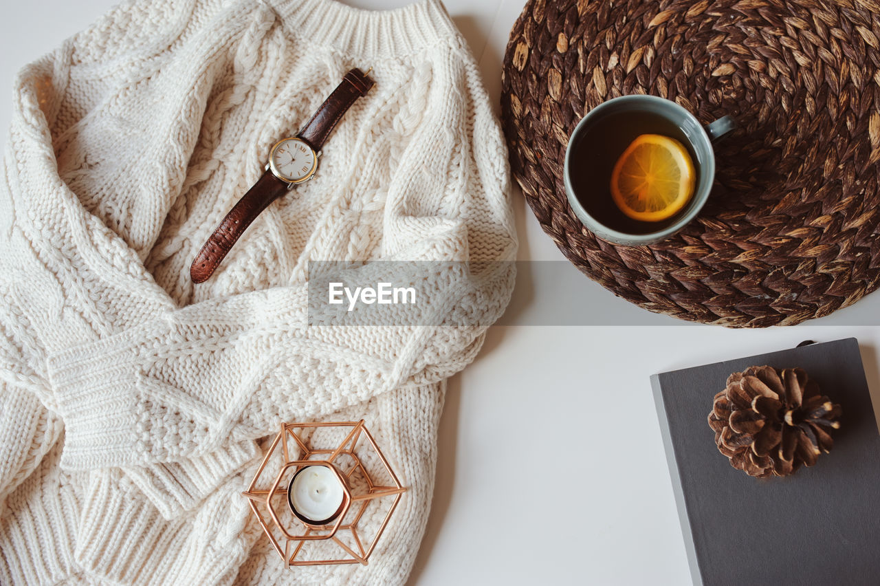 Close-up of coffee and personal accessories on table