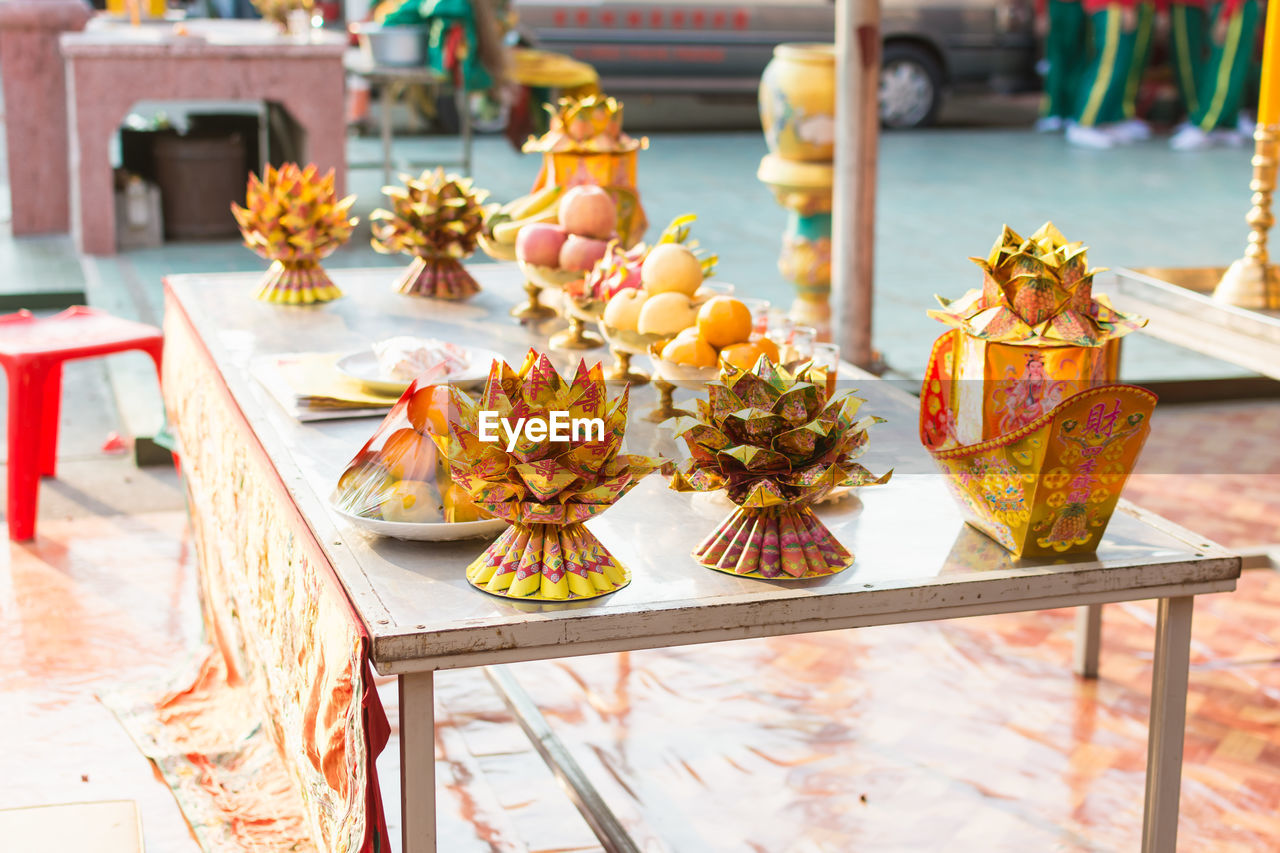 Religious offerings on table outside temple