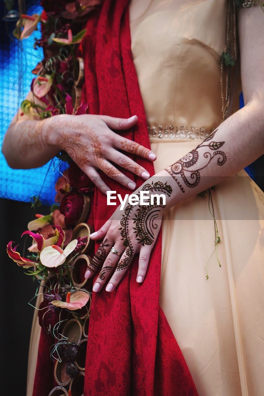 Close-up of woman wearing henna tattoo