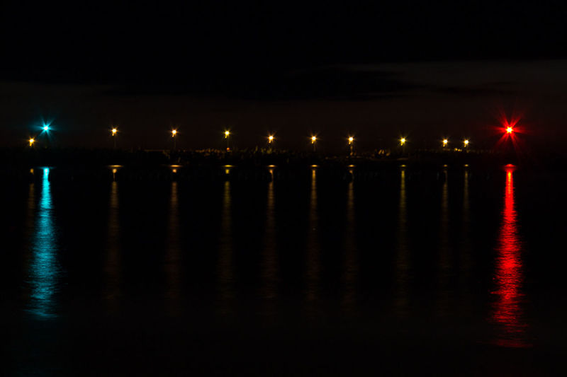 REFLECTION OF ILLUMINATED LIGHTS ON WATER