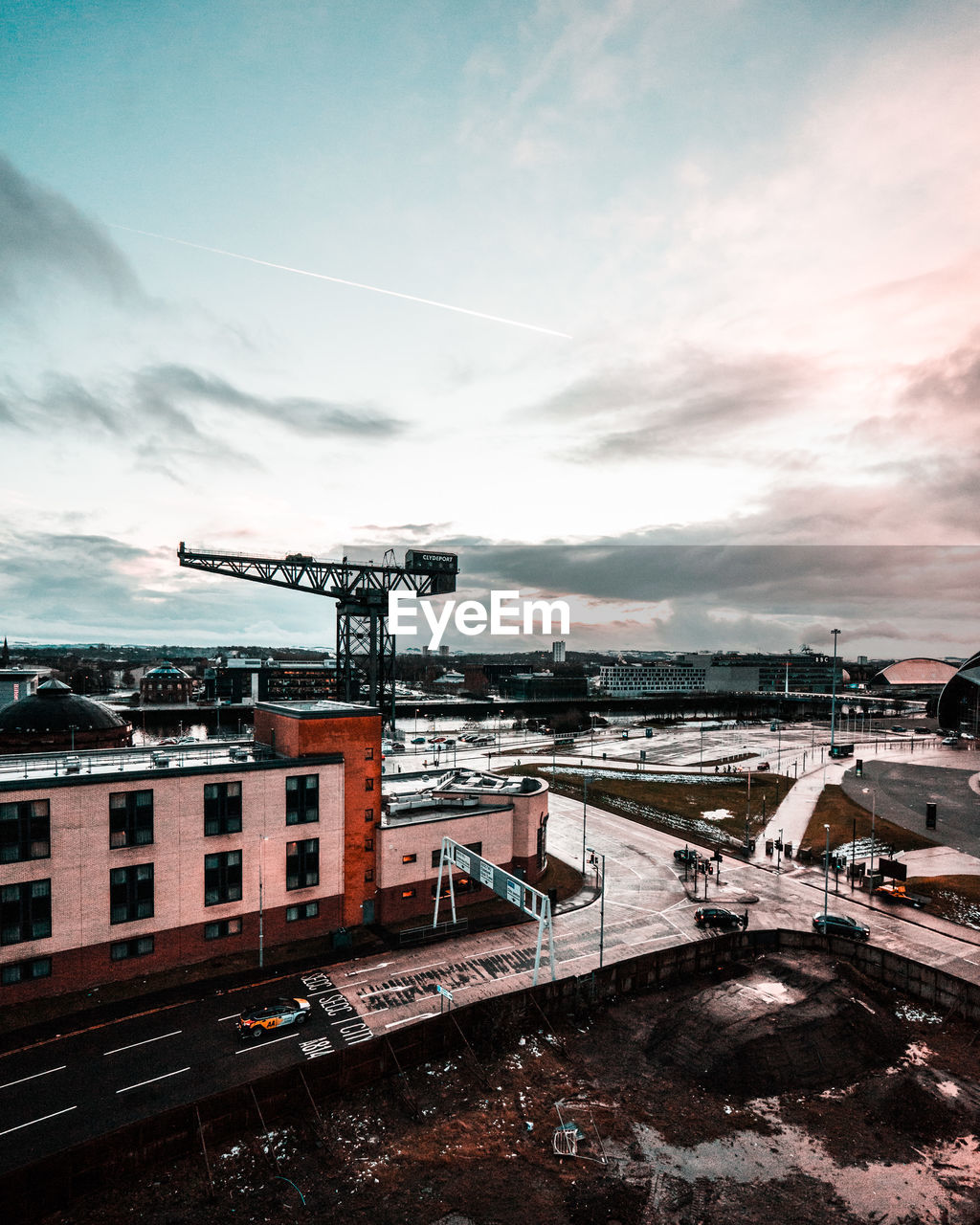 High angle view of construction site in city during sunset