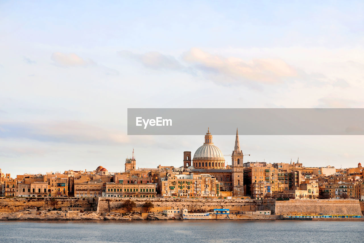 Early winter morning in valletta, malta. cathedral and other historical buildings. panorama view.