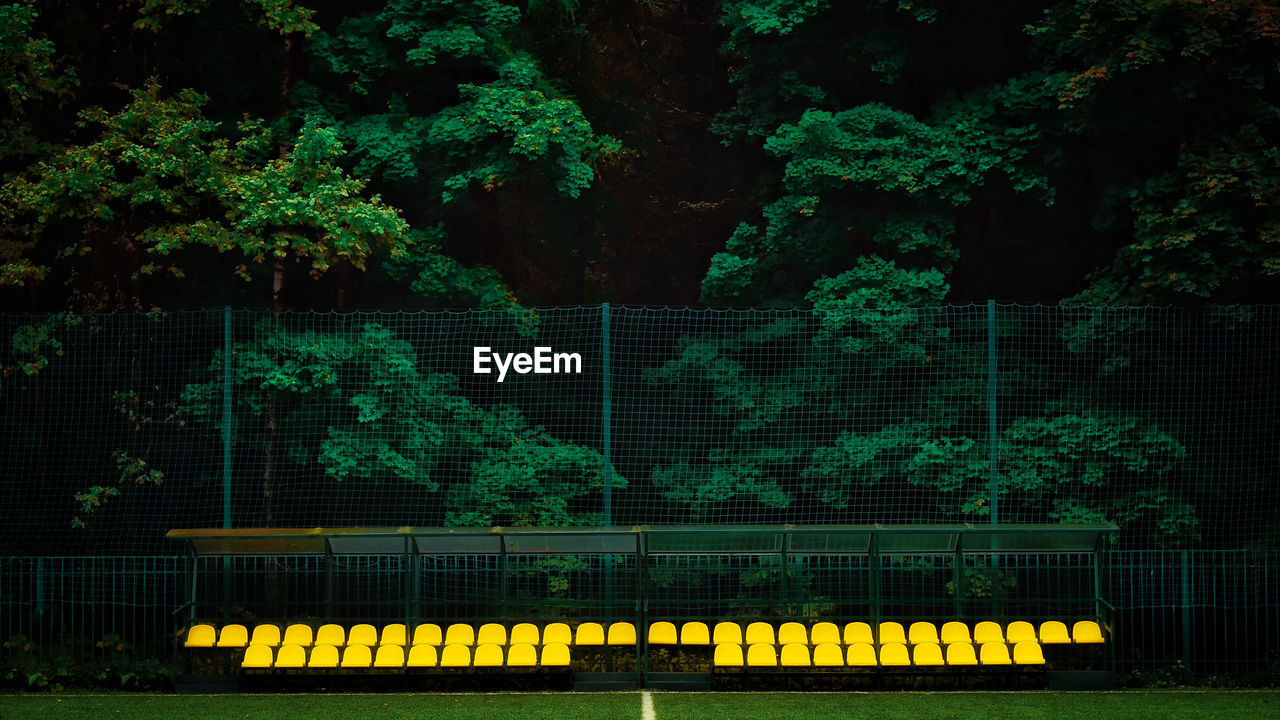 Yellow chairs at sports field 