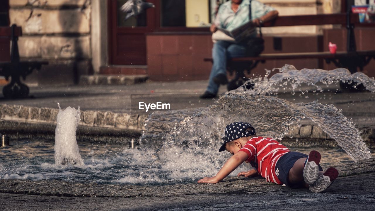 FULL LENGTH OF WOMAN IN WATER