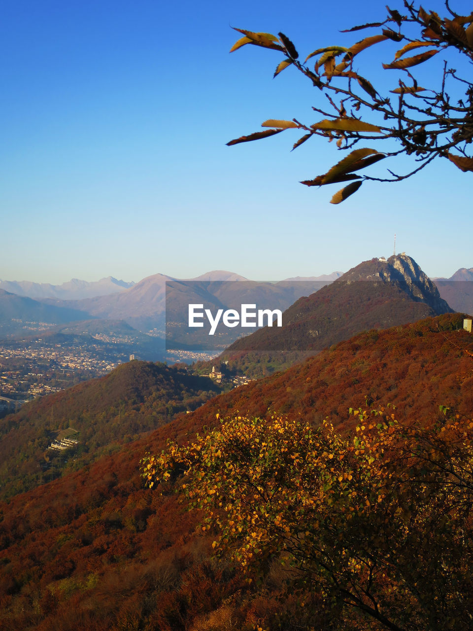 Scenic view of mountains against blue sky