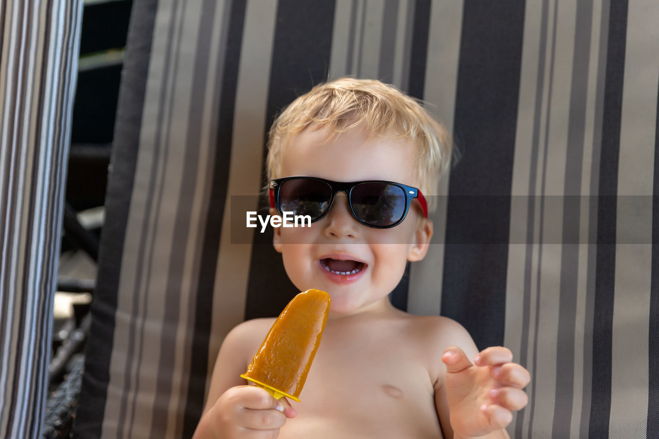 Portrait of boy holding ice cream