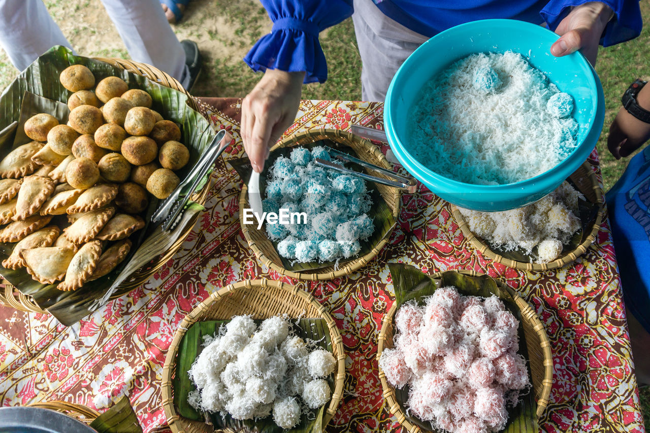 Midsection of person preparing food at table