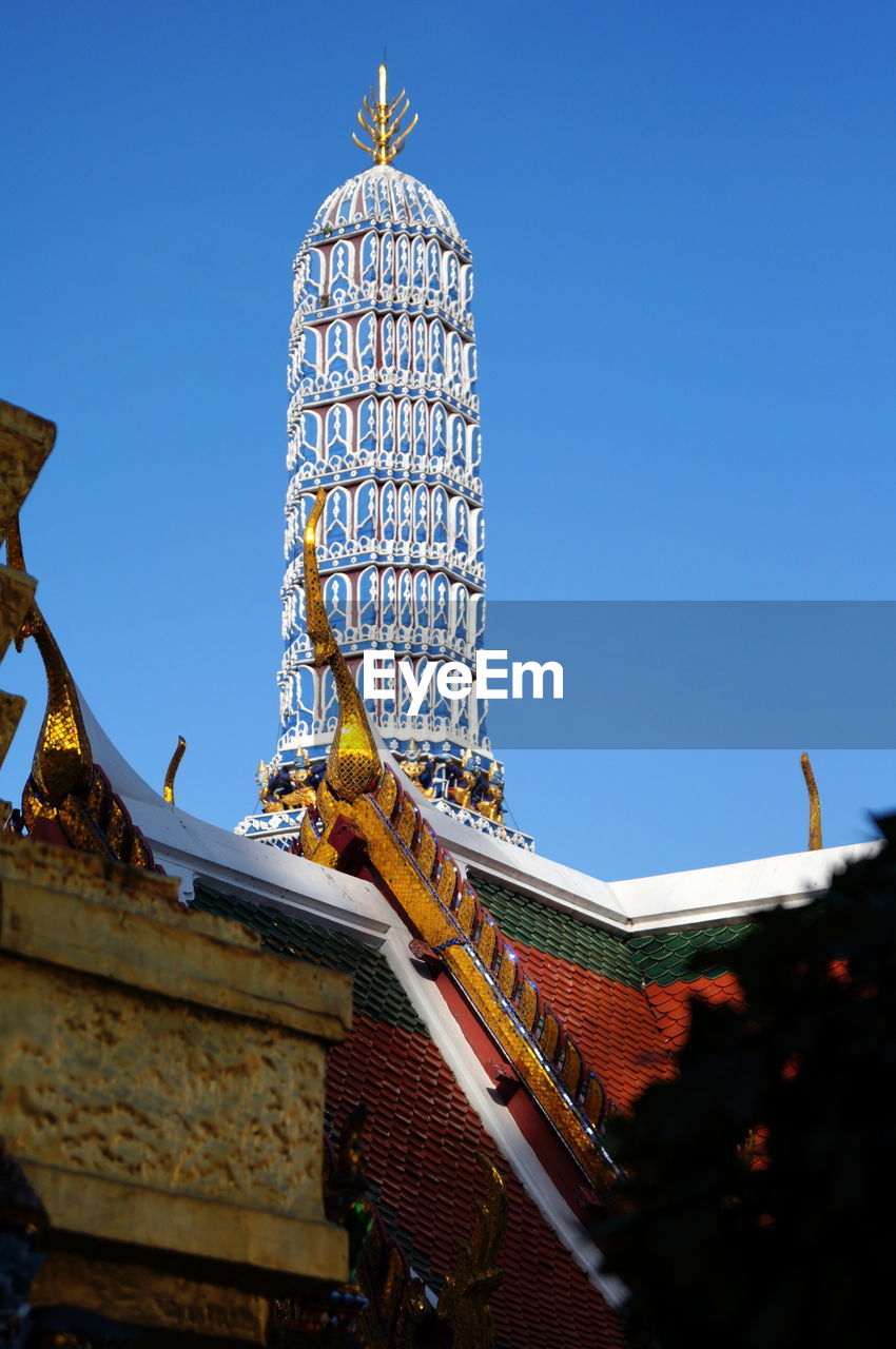 Pagoda at wat phra kaeo against clear sky